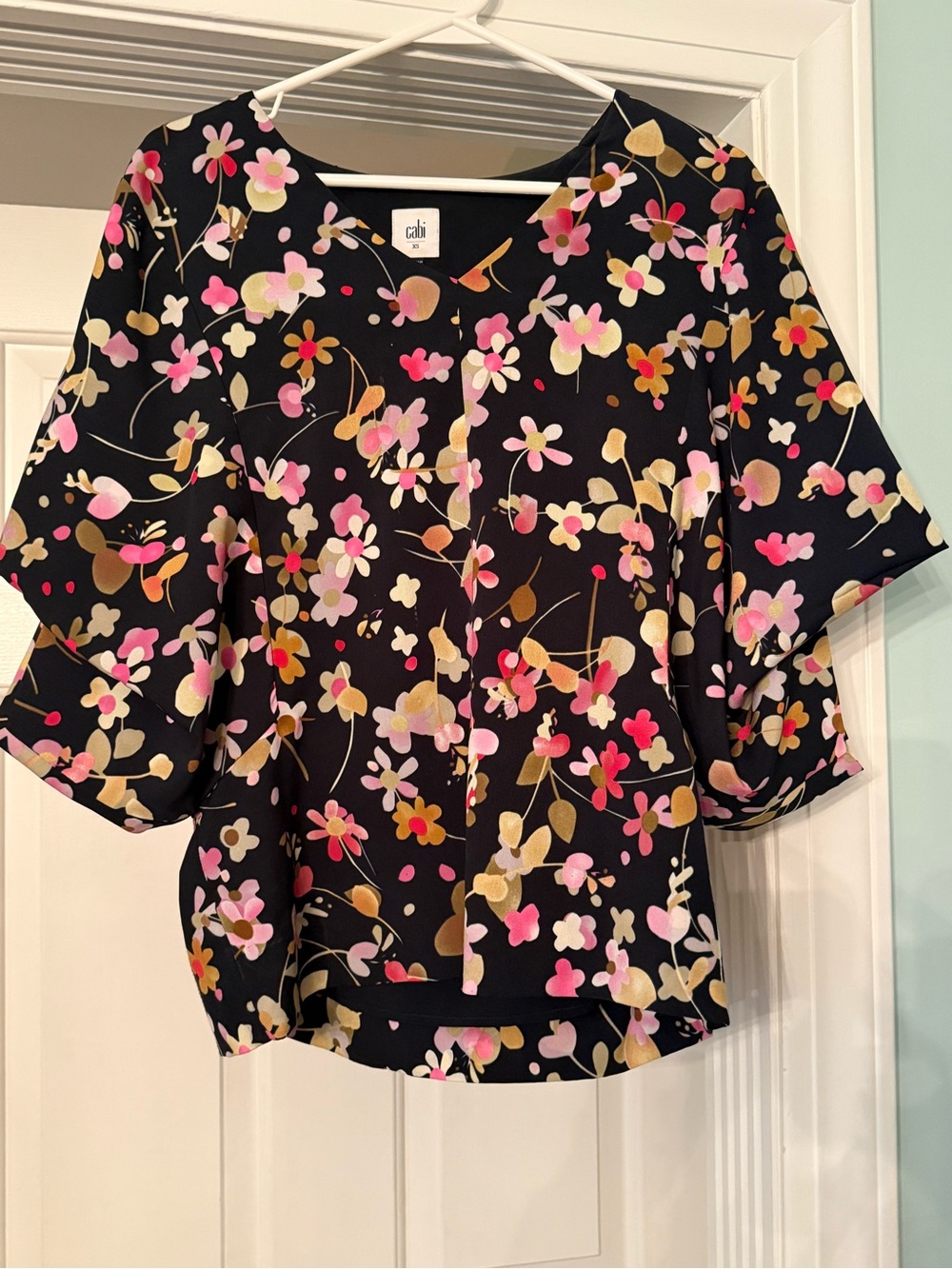CAbi Limited Edition Charmed Blouse Black and Floral V-Neck